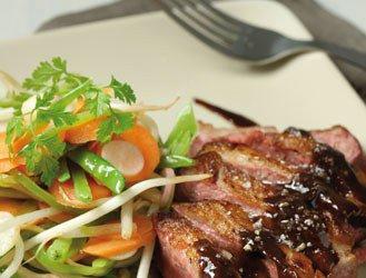 Fillet of duck, cocoa sauce and vegetable wok with agave syrup